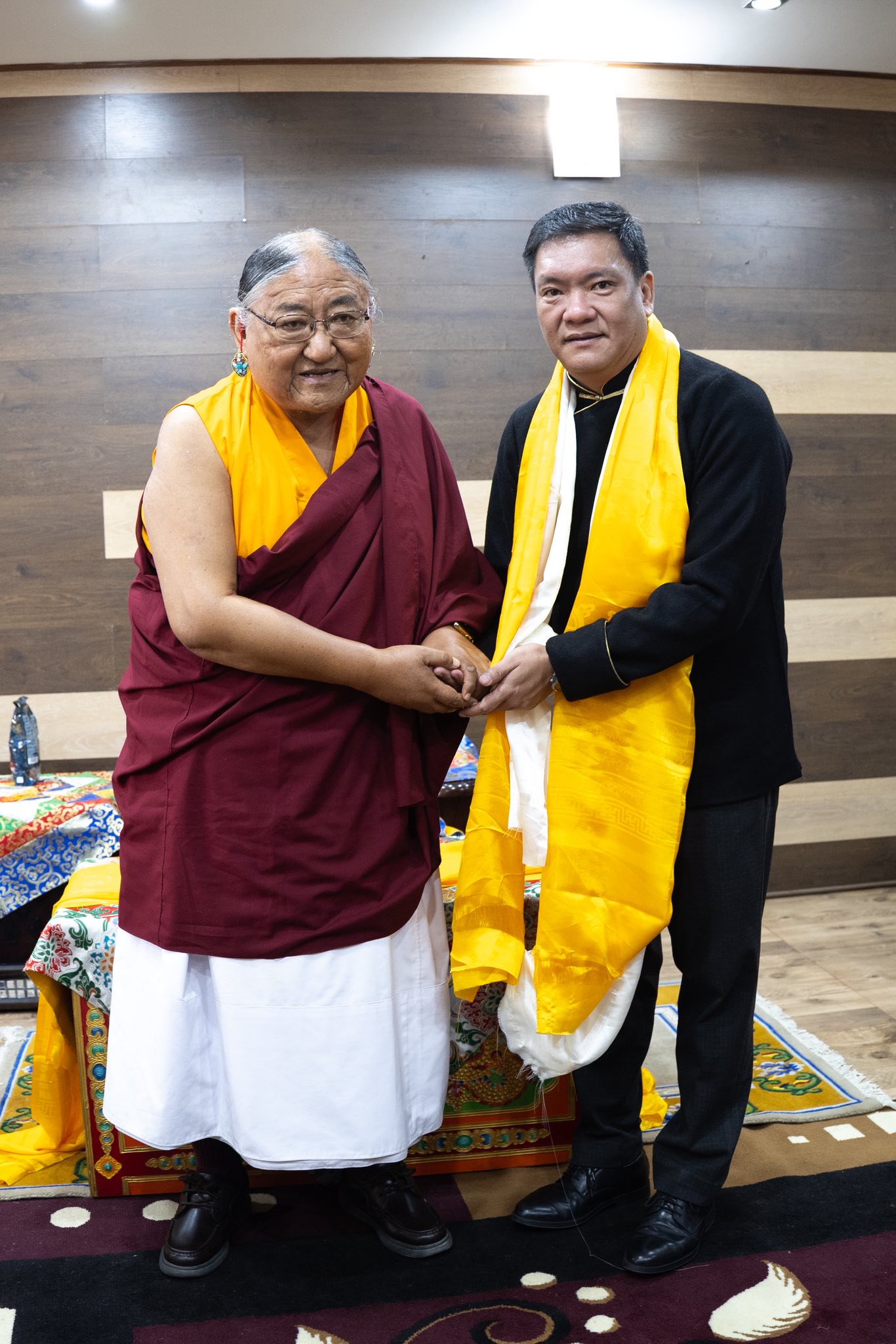 His Holiness standing with a leader in warm fellowship, symbolizing the Sakya tradition's engagement with contemporary society and global leadership